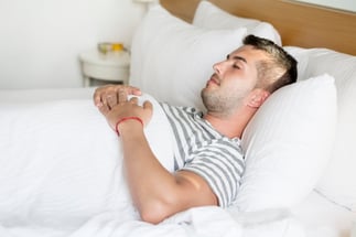 guy-sleeping-with-hands-on-his-chest_1169-35